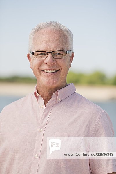 Senior man wearing glasses outdoors  portrait.