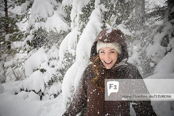 Woman laughing in snow