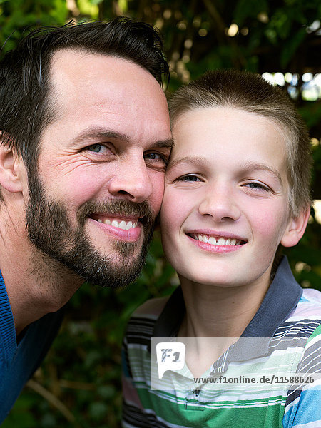 Portrait of father and son  smiling