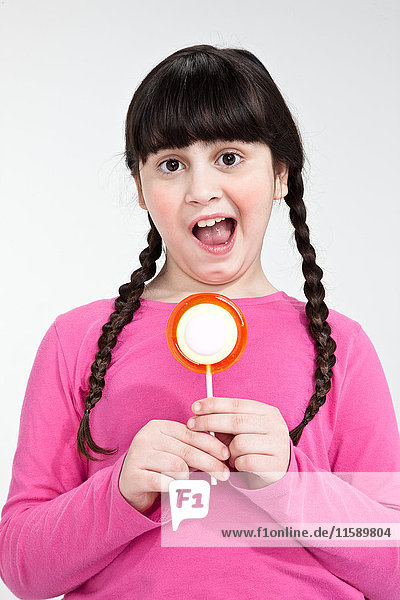 Girl holding lollipop