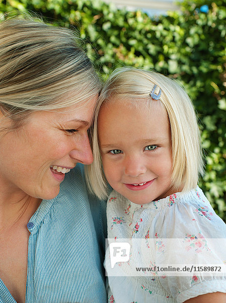 Mother and daughter  smiling  portrait
