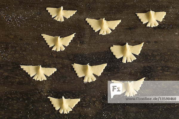 Pasta shaped into birds on board