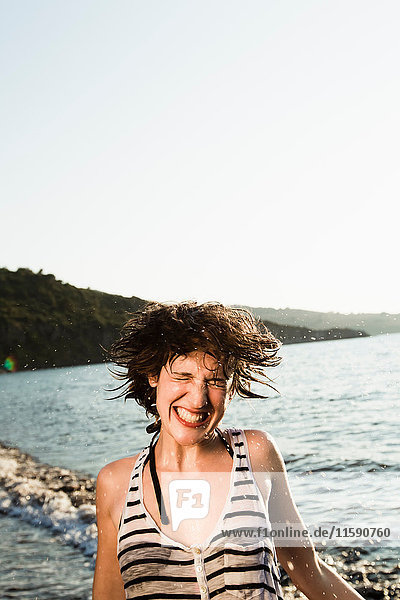 Smiling woman playing on beach