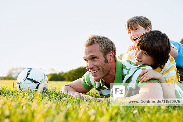 Father And Sons Building Human Pyramid