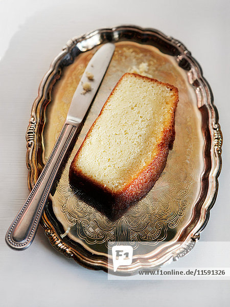 Slice of pound cake on silver plate