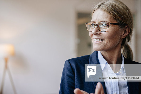 Portrait of confident businesswoman wearing glasses