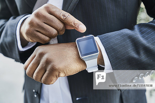 Mature businessman wearing smartwatch
