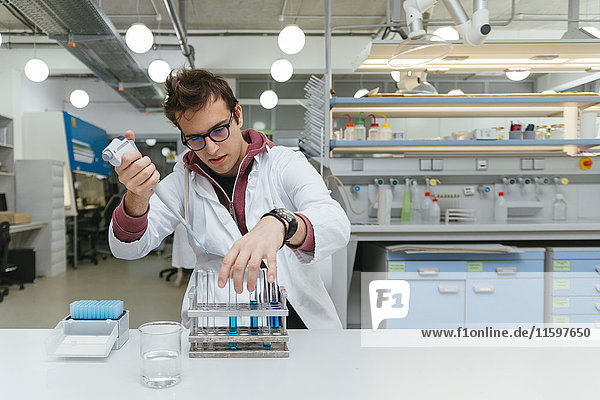 Laboratory technician taking samples in lab