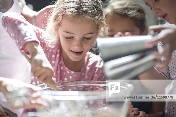 Girls baking in kitchen