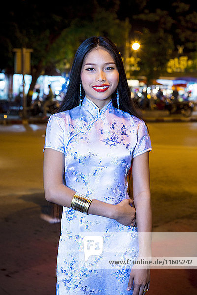 Portrait of smiling Asian woman wearing traditional clothing