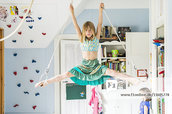 Girl doing splits while hanging