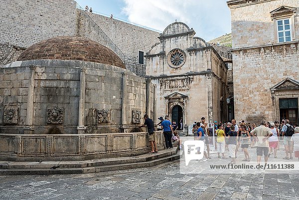 Great Onofrio's Fountain and Saint Saviour Church at Stradun main street of Old Town in Dubrovnik  Croatia.