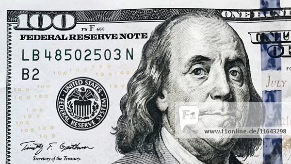 Benjamin Franklin lächelnd und zwinkernd auf der 100-Dollar-Note