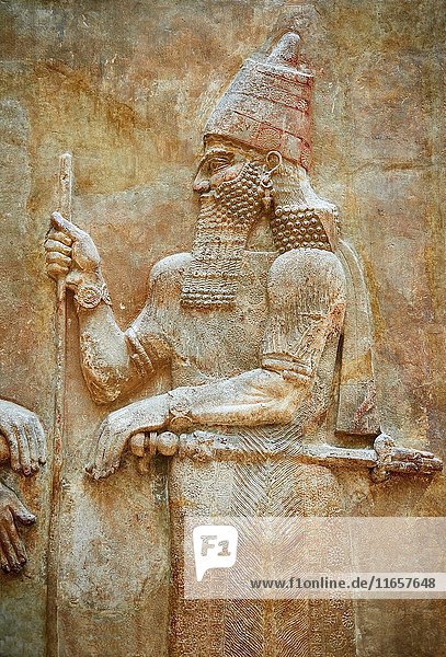 Stone relief sculptured panel of Saron II. Facade L. Inv AO 19873-4 from Dur Sharrukin the palace of Assyrian king Sargon II at Khorsabad  713-706 BC. Louvre Museum Room 4   Paris.