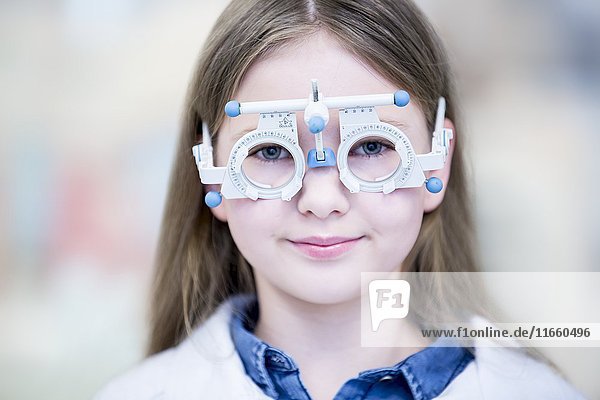 Portrait of girl wearing trial frame  close-up.