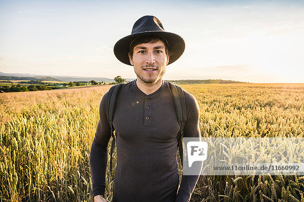 Portrait of mid adult man standing in field Neulingen Baden-Württemberg Germany