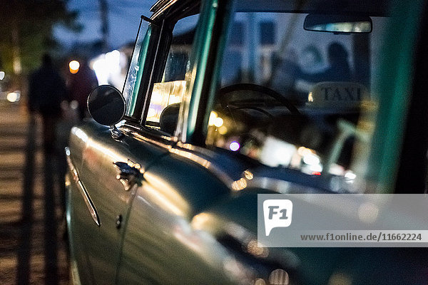 Close up of vintage car on roadside at dusk Vinales Cuba