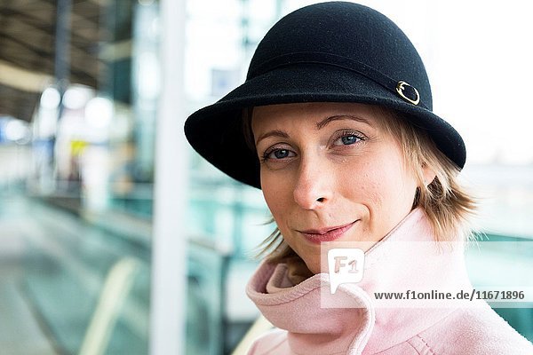 Tilburg  Netherlands. Young adult caucasian female waiting for her intercity train to take her to her work assignment as a musci teacher.