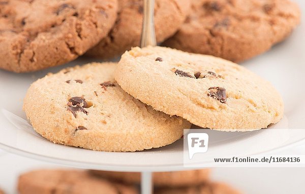 Chocolate chip cookies on plate in close up. Sweet food dessert or snack.