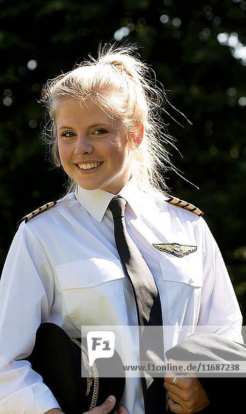 Portrait of a young female pilot in uniform