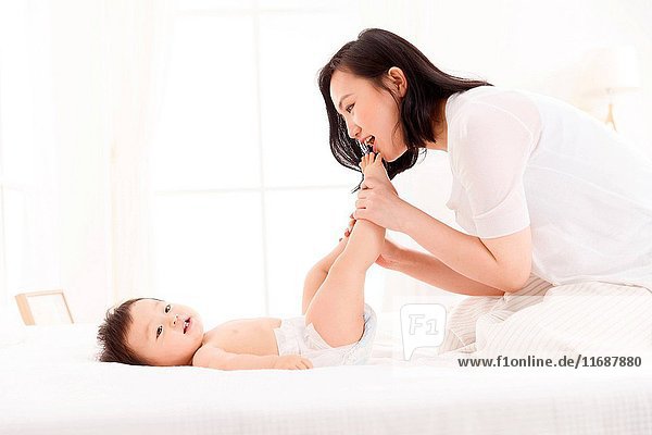 Mother playing with her baby