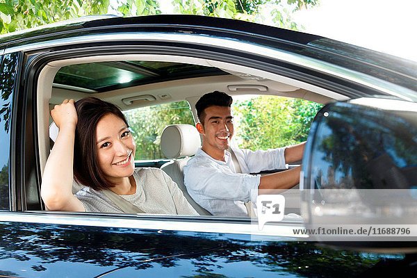 Young couple driving on trip