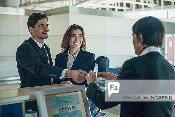 Businesspeople at airport check in area