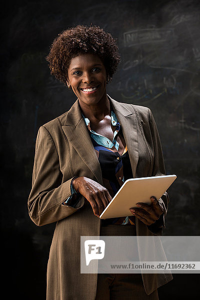 Businesswoman holding digital tablet