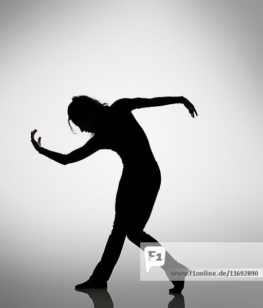 Silhouette of woman dancing