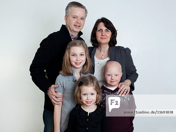 Family portrait with two daughters and son with Down's Syndrome