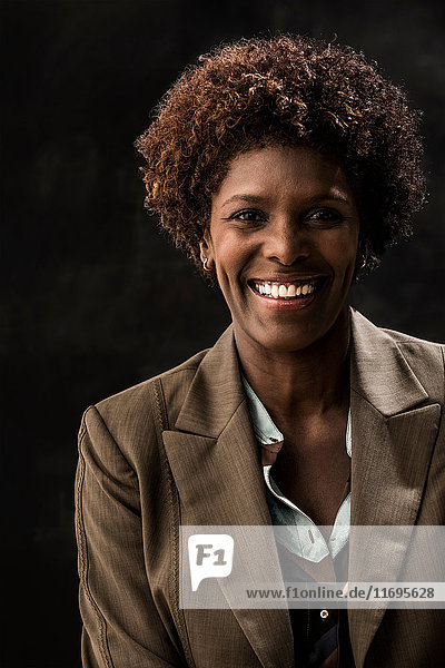 Portrait of businesswoman wearing brown jacket