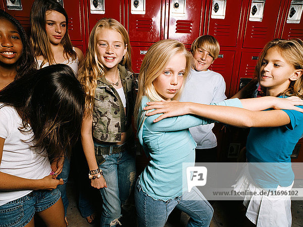 Girls posing in school locker room  portrait