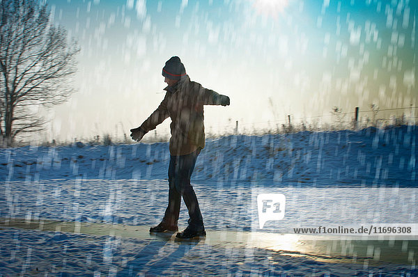 Man playing in snow
