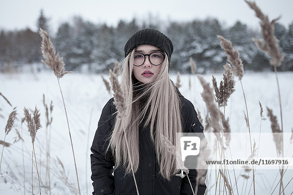 Wind blowing hair of Asian woman in winter