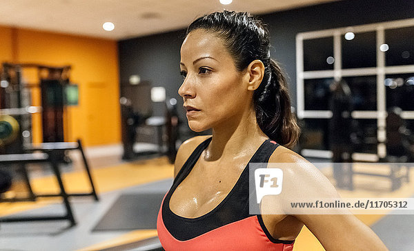 Portrait of a woman sweating after training in the gym