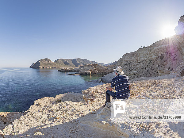 Spain  Andalusia  Cabo de Gata  back view of man looking at the sea