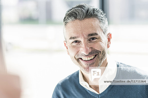 Portrait of happy businessman with stubble