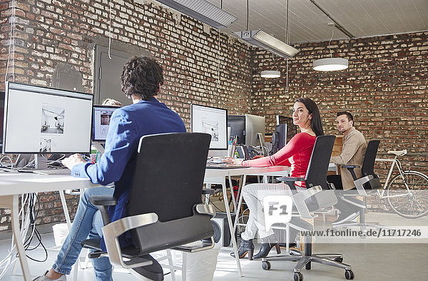 Group of people working in creative office  looking content