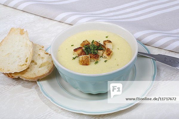 Cheese soup with herb croutons  plate  bowl  bread slices