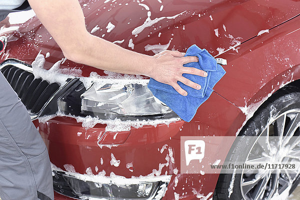 Man cleaning car at car wash
