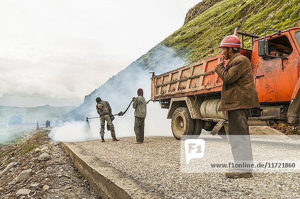 'Chinese workers making a road; Daocheng Sichuan province China'