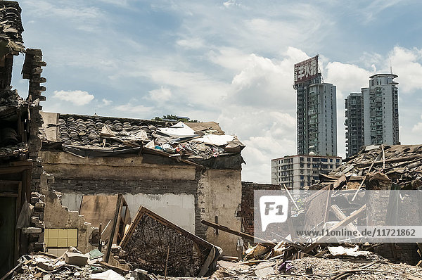 'NoneOld neighborhood surrounded by skyscrapers Chongqing is a city with really fast development that people cannot handle having huge changes every year; Chongqing China'