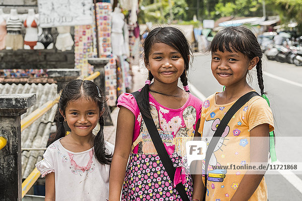 'Portrait of three young girls; Tegallalong Bali Island Indonesia'