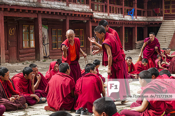 'Litang Monastery the main temple where the young buddhist monks are preparing a Tibetan debate; Litang Sichuan China'