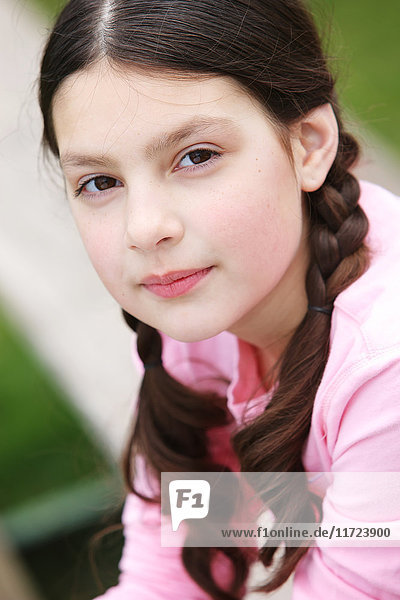 'Portrait of a young girl with brunette hair in braids; Oregon  United States of America'