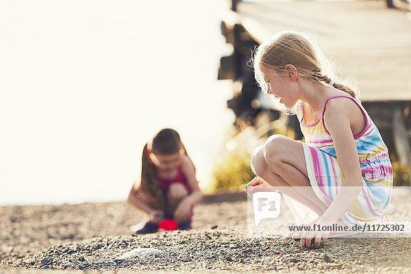 Girls playing in sand