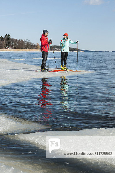 Man and woman standing on ice floe