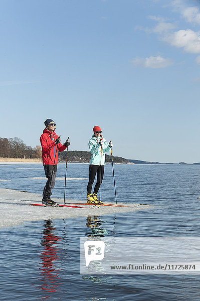 Man and woman standing on ice floe