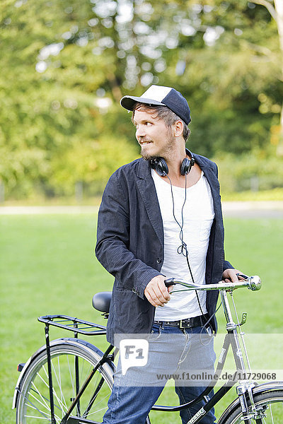 Man in park with bicycle