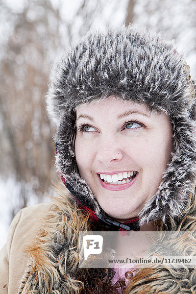 Close up portrait of mid adult woman in furs